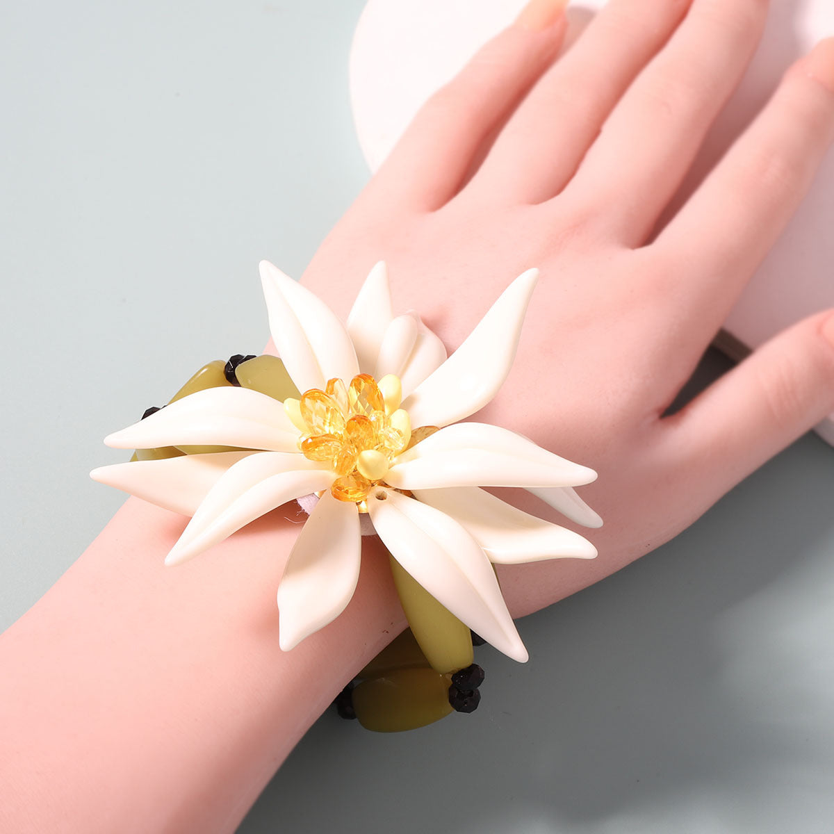Layered Bracelet With White Resin Flower Pendant