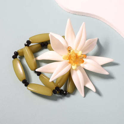 Layered Bracelet With White Resin Flower Pendant